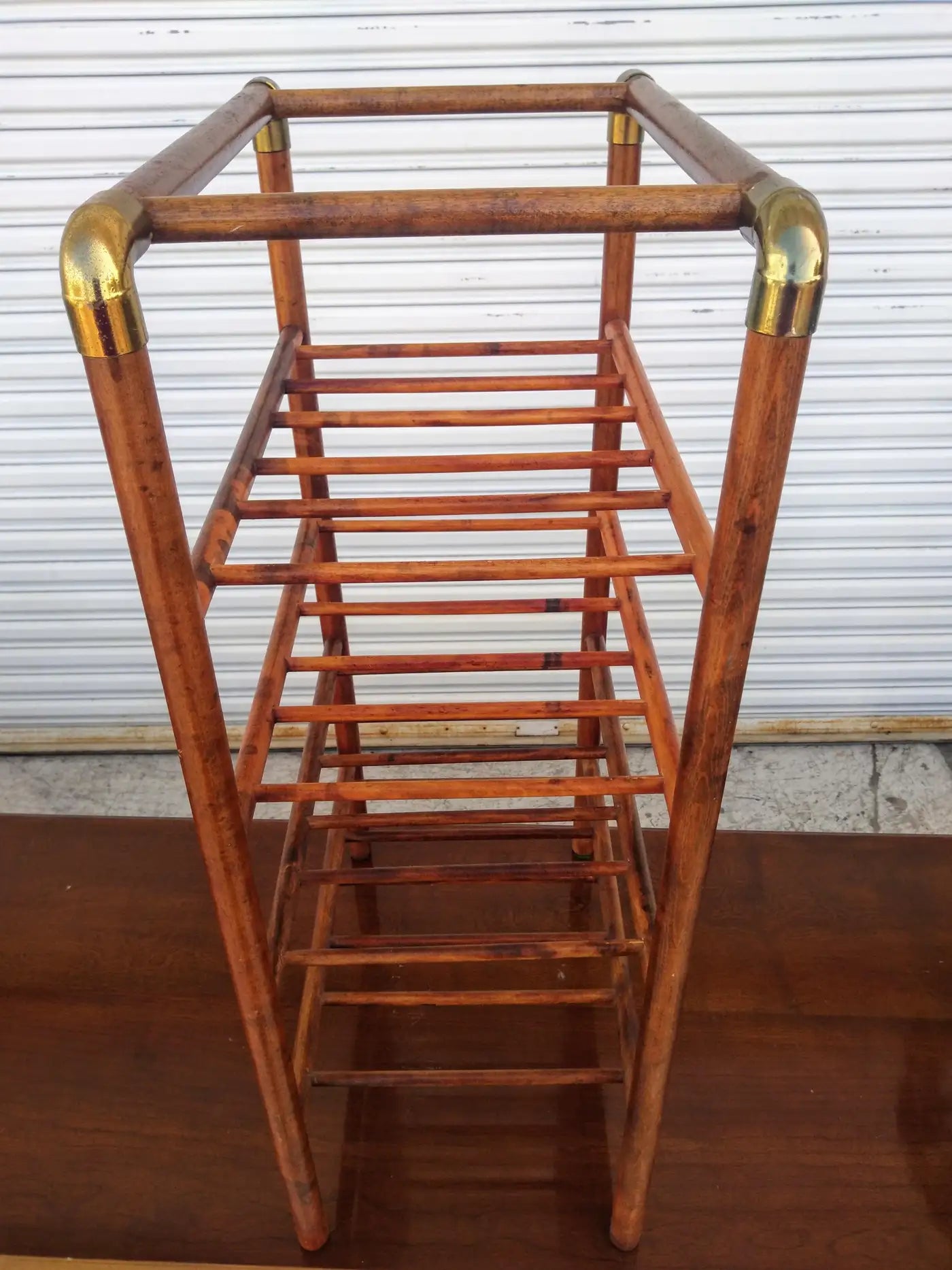 Bentwood wine rack with brass accents