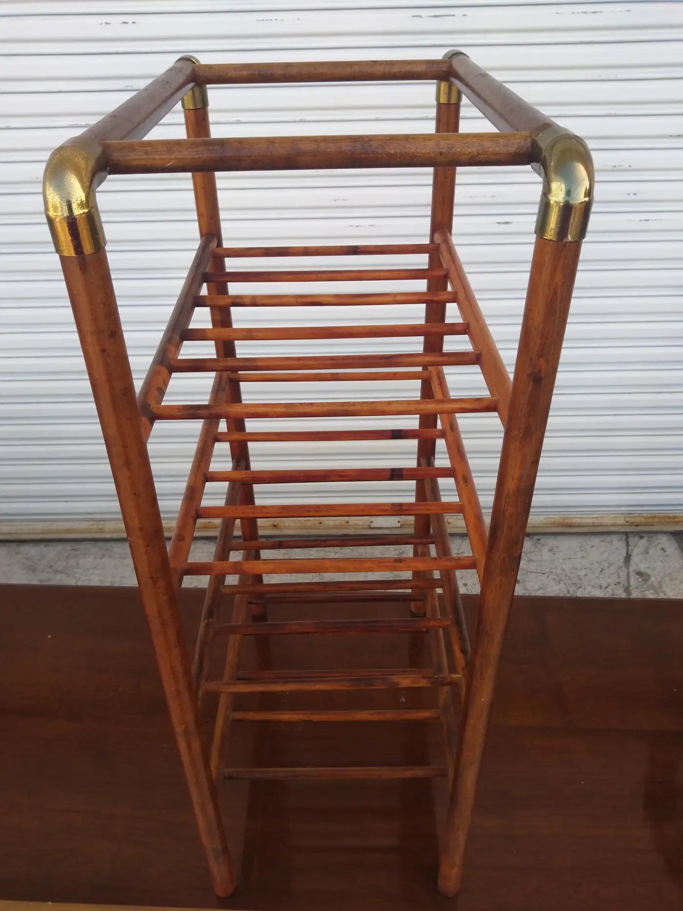 Bentwood wine rack with brass accents