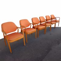 Orange Don Pettit Arm Chair by Knoll, featuring a striking color and modern design that enhances any room with style and flair.