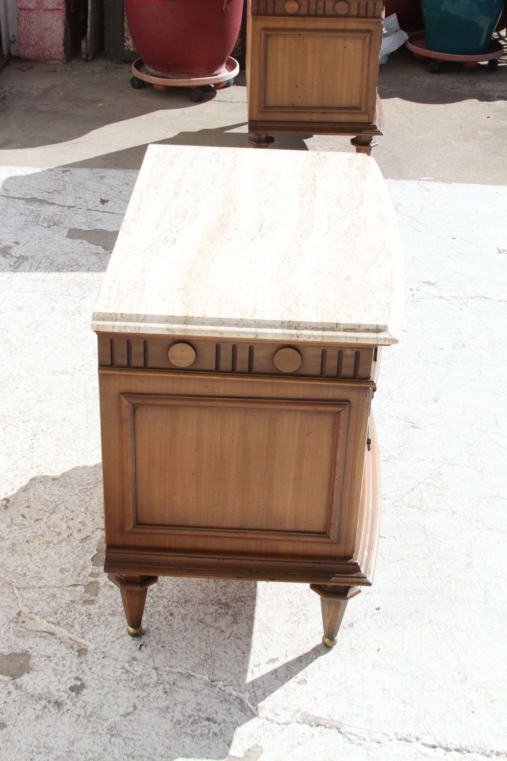 bedroom's decor with these modern nightstands, featuring luxurious Italian Travertine marble tops.