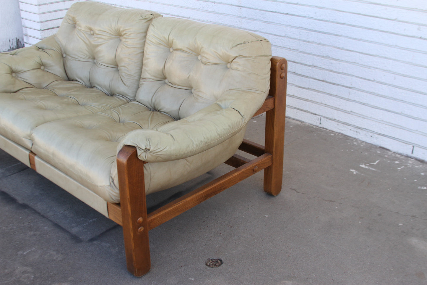 Mid Century teak loveseat. Expertly crafted for lasting beauty, this love seat sofa is the perfect addition to any modern home. A rare find!