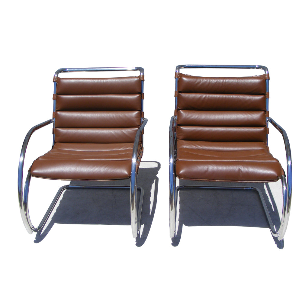 Pair of MR Lounge Arm Chair, known for its sleek silhouette and ergonomic support, perfect for contemporary living rooms or lounges.