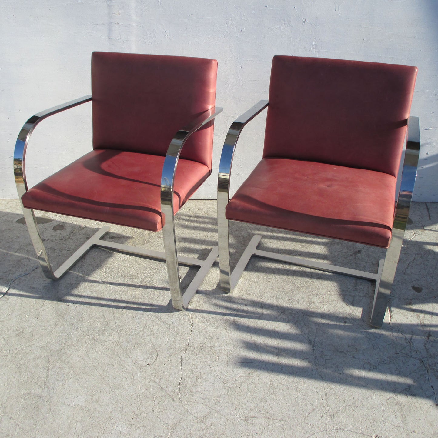 Pair of Red Brno Stainless Steel Flat Bar Chairs, featuring a modern stainless steel frame and bold red upholstery for stylish seating.