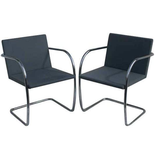 Tubular Brno Leather Chairs with thin pads. Designed by Mies van der Rohe. Cantilevered steel frames, supple leather seats. Stylish, comfortable seating for living or office.