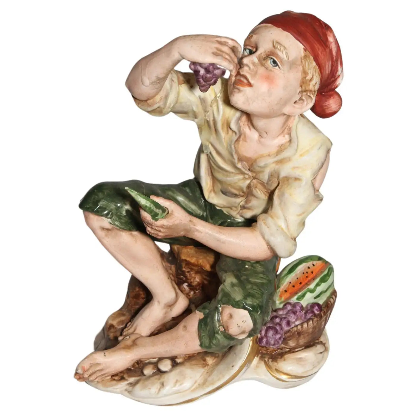 Man eating grapes and watermelon sculpture